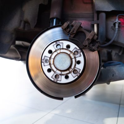 close-up-of-a-car-disc-brake-system-in-a-garage-2026-08-18-14-47-28-utc-1.jpg